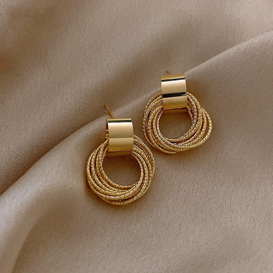 Metallic gold drop circle earrings